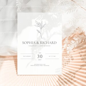 May include: A minimalist wedding invitation with a simple line drawing of a branch with leaves. The invitation is printed on white cardstock and features the names "Sophia & Richard" and the date "August 30, 2021".