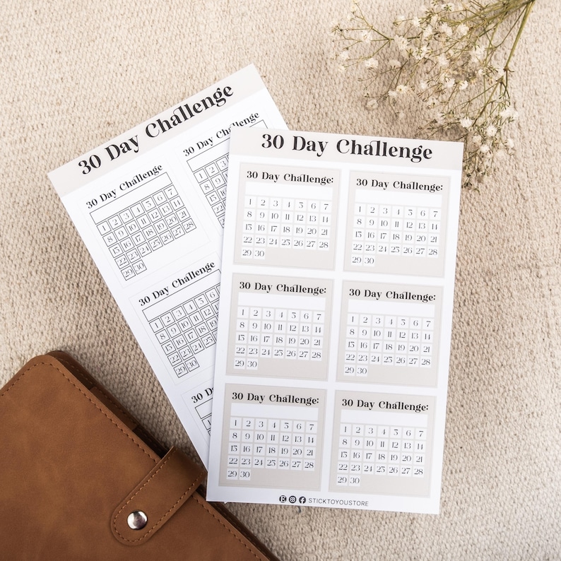 May include: A set of six printable 30-day challenge calendar stickers with a beige background and black text. Each sticker features a calendar grid with the numbers 1 through 30.