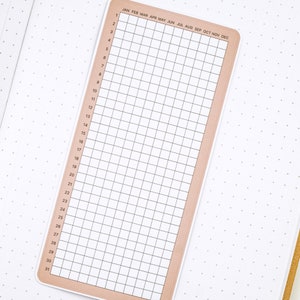 May include: A brown and white calendar grid with the months of the year listed across the top and the days of the month listed down the side.