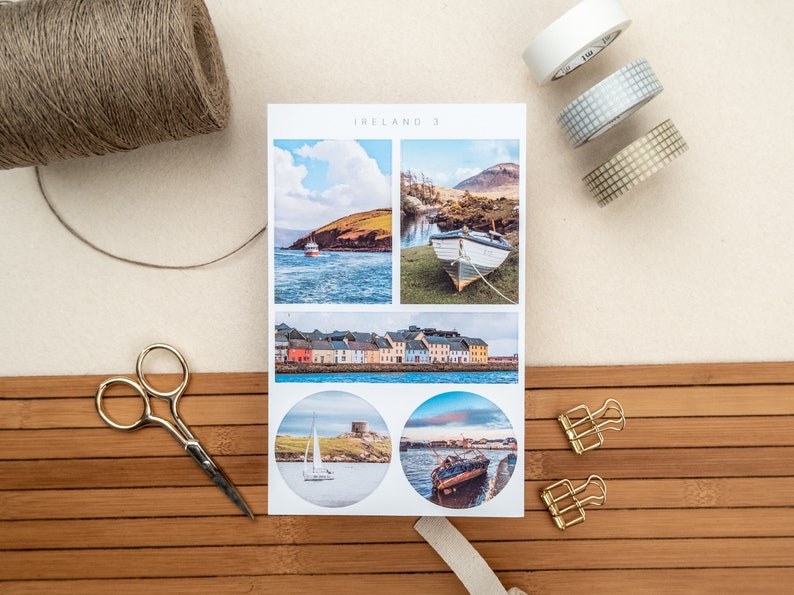 May include: A set of four stickers featuring scenic views of Ireland. The stickers are printed on white paper and have a glossy finish. The images include a boat in a harbor, a row of colorful houses, a lighthouse on a rocky island, and a sunset over the water.