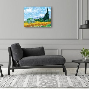 May include: A painting of a field of yellow flowers with a single cypress tree in the background. The sky is blue with white clouds. The painting is in a modern living room setting with a gray couch and a black side table.