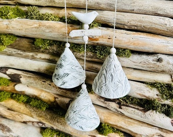 Handmade ceramic garden decoration.Composition of 3 floral pressed bells with driftwood.White clay .Handmade.Wind Chimes.Fine craft.