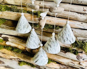 Handmade ceramic bells..Composition of 5 floral pressed bells with driftwood.Room and Garden Decor.Handmade.Wind Chimes.Fine craft.