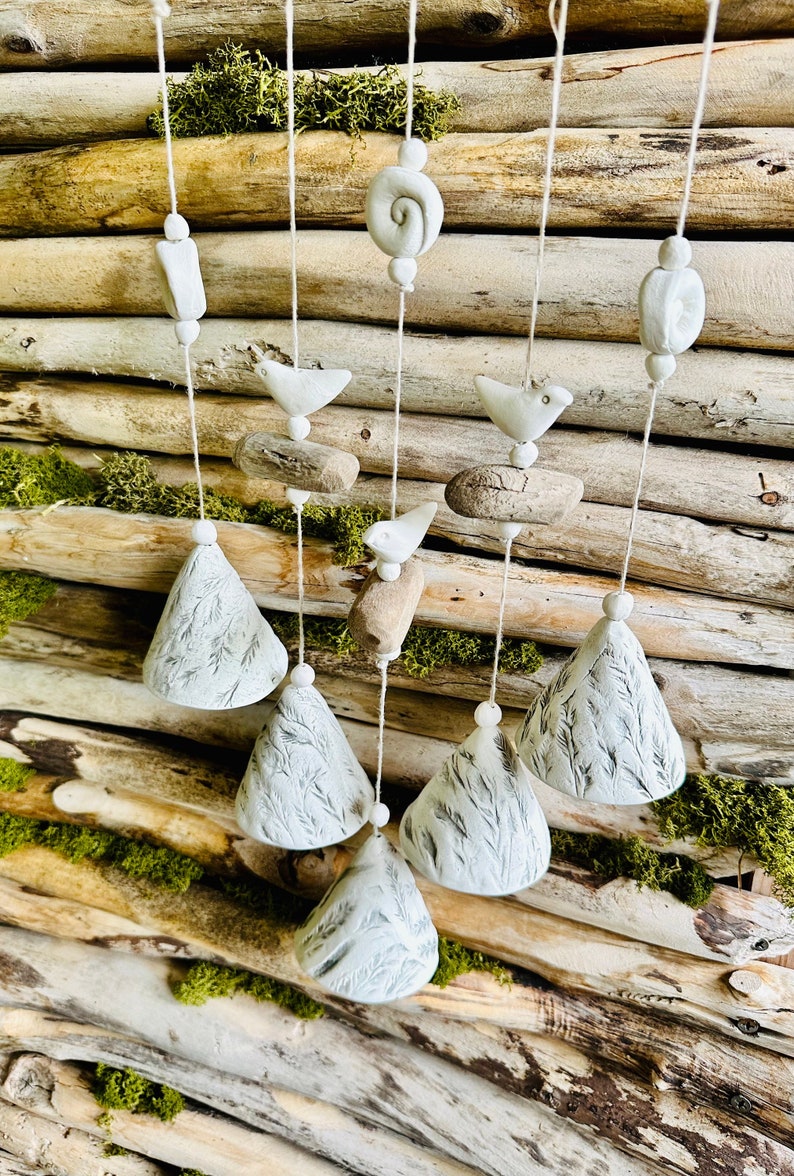 Handmade ceramic bells..Composition of 5 floral pressed bells with driftwood.Room and Garden Decor.Handmade.Wind Chimes.Fine craft. image 1