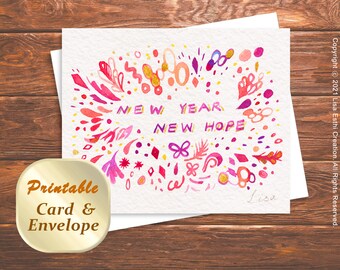 Peut inclure: Carte et enveloppe imprimables avec un motif aquarelle d'éléments floraux roses, rouges et dorés. Le texte "NEW YEAR NEW HOPE" est écrit en lettres dorées.