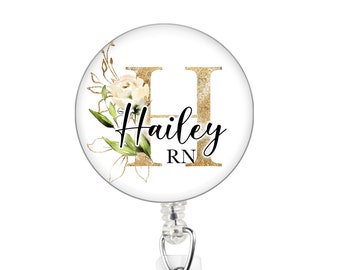 Golden floral monogram badge reel