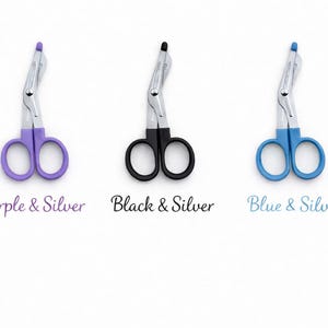 May include: Three silver and colored medical shears with curved blades. The shears are available in purple, black, and blue, each with silver accents. Text below each shear reads "Purple & Silver", "Black & Silver", and "Blue & Silver".