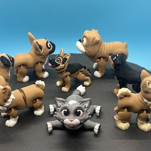 May include: A set of eight articulated animal figurines, including a cat, a corgi, a bulldog, a french bulldog, a german shepherd, a chihuahua, a husky, and a shiba inu. The figurines are made of brown, black, and gray plastic and have movable limbs.