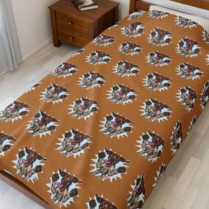 May include: A brown single bed duvet cover with a repeating pattern of a cartoon dog in a blue and white burst. The dog has brown and black spots and a pink tongue, in a playful pose. The duvet cover is made of a soft material.