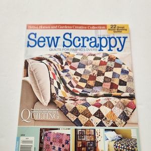 May include: A magazine cover titled "Sew Scrappy" featuring a patchwork quilt. The cover includes the text "Quilts for Fabric Lovers" and "22 Great Stash-Busting Quiltal." Below are images of throws, wall hangings, and bed quilts.