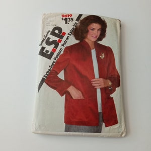 May include: A Simplicity sewing pattern for a red blazer with a mandarin collar. The pattern number is 9619 and the price is $1.35. The pattern is for a miss or young woman.