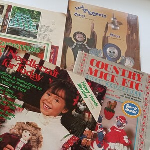 Puede incluir: Una colección de libros de manualidades con portadas coloridas. Los libros tienen títulos como "Proyectos de Navidad creativos", "Manualidades para hoy", "Ratones de campo, etc." y "Marionetas de mano".