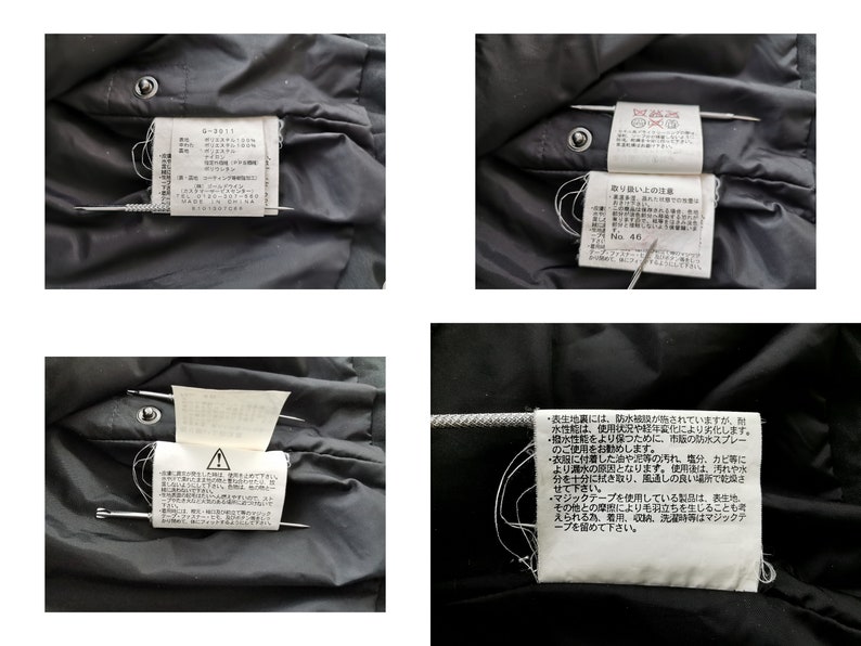 Pode incluir: Close-up de uma pe&ccedil;a de roupa preta com v&aacute;rias etiquetas brancas presas com alfinetes. As etiquetas cont&ecirc;m texto japon&ecirc;s e instru&ccedil;&otilde;es de cuidado. A pe&ccedil;a de roupa tem um detalhe de bot&atilde;o.