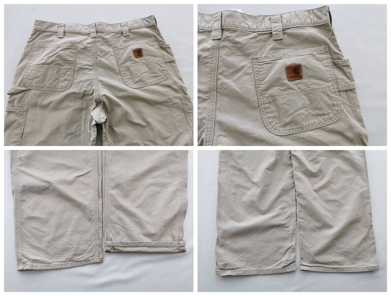 May include: Tan work pants with multiple pockets, including two large side pockets and two back pockets. A brown leather patch with the Carhartt logo is visible on the back pocket. The pants have a straight leg design.