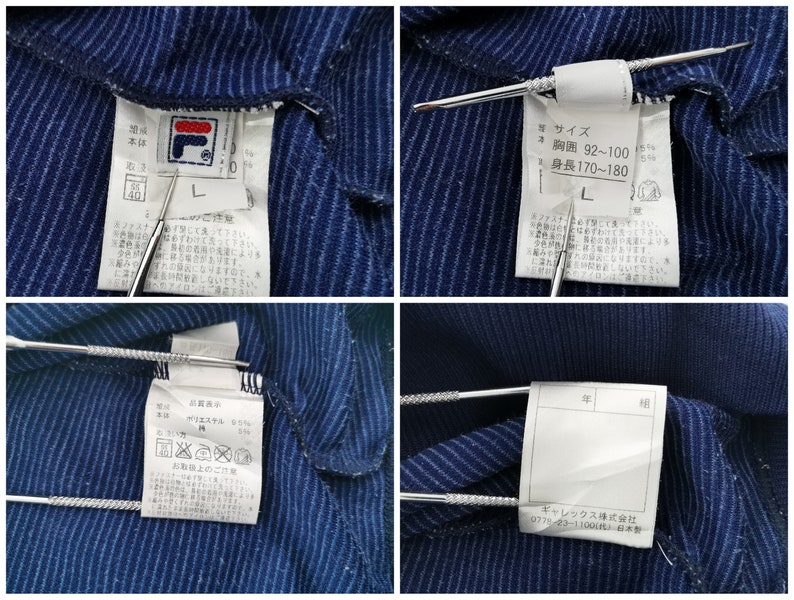 Puede incluir: Una prenda de color azul oscuro con rayas finas y etiquetas blancas de cuidado y talla en el interior. Las etiquetas muestran el logotipo de Fila, la talla L y texto en japon&eacute;s que indica un pecho de 92-100 cm y una altura de 170-180 cm.