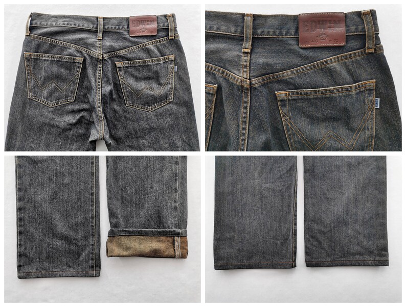 May include: Four-panel image of dark grey denim jeans. The jeans have a classic five-pocket design, with a leather patch on the back waistband. The back pockets feature a distinctive stitched design. The cuffs are folded up, revealing a lighter-coloured interior.