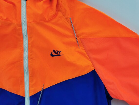 Neon orange on sale nike windbreaker