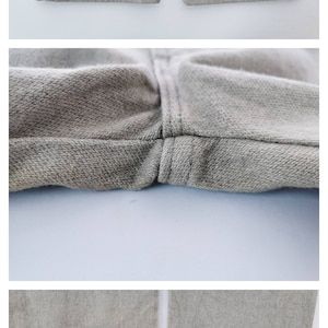 May include: Close-up shots of light brown pants. The images show details of the fabric, seams, and the bottom hem of the pants. The fabric appears to be a soft, woven material. One image shows a small tear near the hem.