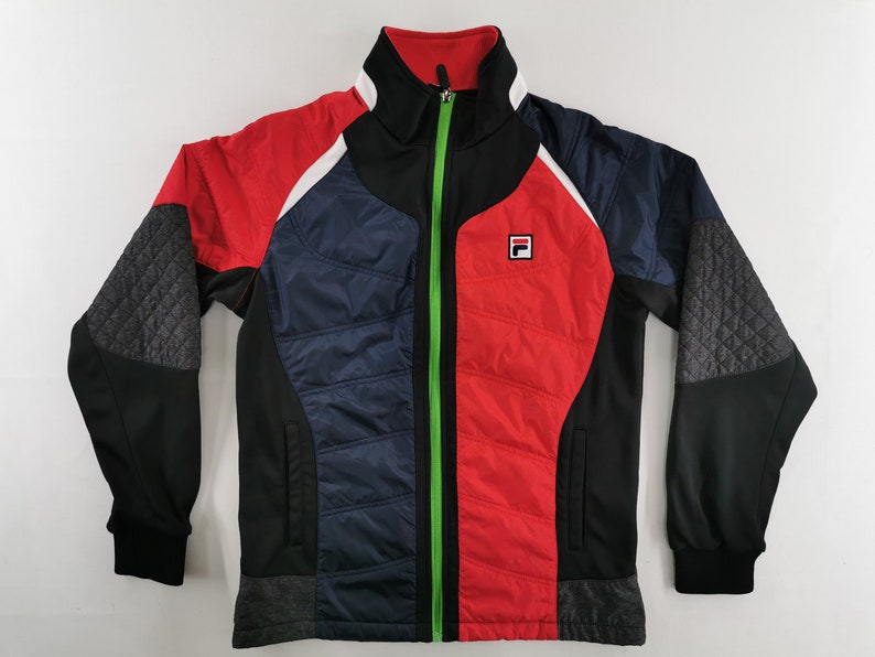 May include: A multi-colored jacket with a full zipper. The jacket features a red, navy blue, black, and gray color scheme. The jacket has a quilted pattern on the sleeves and a small logo on the chest.