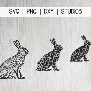 May include: Three black and white geometric rabbit silhouettes. The rabbits are in a sitting position. The rabbits are made up of small geometric shapes.