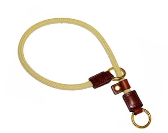 May include: A beige rope dog collar with brown leather accents and gold metal hardware.