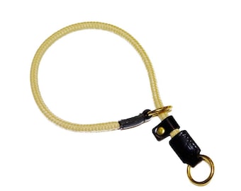 May include: A beige rope dog collar with a black leather buckle and a gold metal ring.