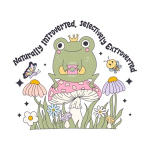 May include: A green frog wearing a crown sits on a pink and white mushroom with a peace sign on its chest. The frog is surrounded by flowers and butterflies. The text "Naturally Introverted, Selectively Extroverted" is written around the frog.