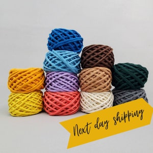May include: A collection of ten balls of colorful cotton rope, arranged in a pyramid shape. The colors include blue, light blue, brown, beige, green, gray, yellow, and orange. The text "Next day shipping" is visible in the lower right corner of the image.