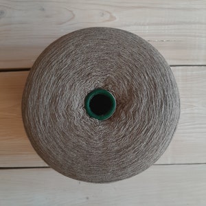 May include: A ball of brown yarn with a green centre hole.