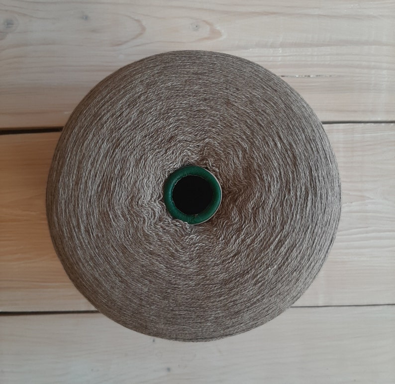 May include: A ball of brown yarn with a green centre hole.