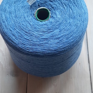May include: A blue ball of yarn with a white label that says "Cash 4 L-11-32"