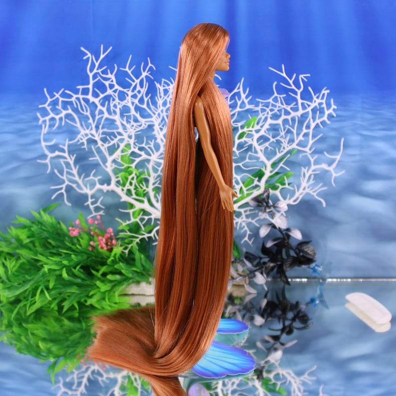 A warm auburn brown Japanese saran doll hair for rerooting standard 11.5 inch fashion dolls, monster high reroots, custom doll rehairing and restoring all doll and toy types. Ariel mermaid reroot not included.