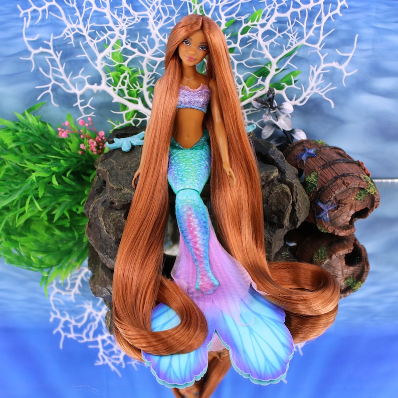 A warm auburn brown Japanese saran doll hair for rerooting standard 11.5 inch fashion dolls, monster high reroots, custom doll rehairing and restoring all doll and toy types. Ariel mermaid reroot not included.