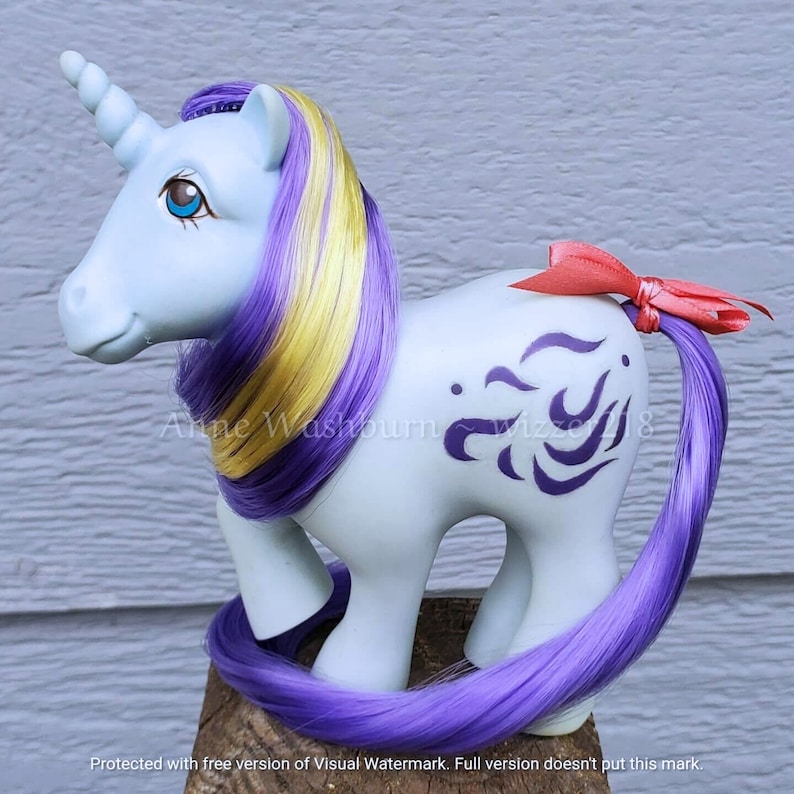 A pretty medium purple violet high quality nylon doll hair for rerooting dolls, monster high reroots, standard 11.5 inch fashion dolls, custom rehairing and restoring all doll and toy types. My Little Pony reroot not included.