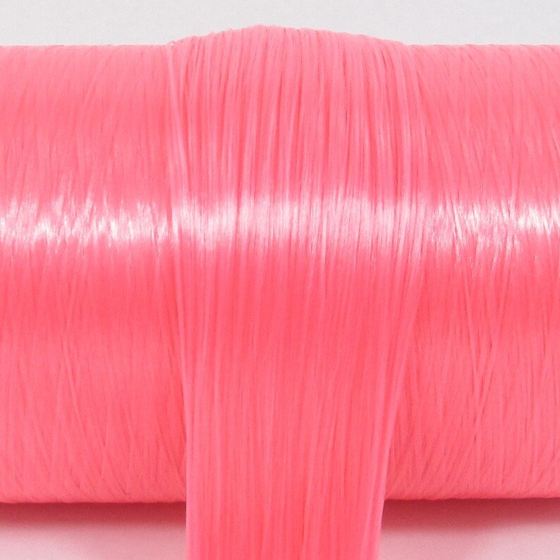 A bright pink high quality nylon doll hair for rerooting dolls, monster high reroots, standard 11.5 inch fashion dolls, custom rehairing and restoring all doll and toy types.
