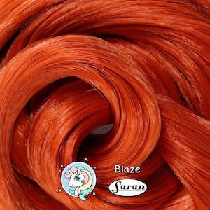 A fiery red auburn Japanese saran doll hair for rerooting standard 11.5 inch fashion dolls, monster high reroots, custom doll rehairing and restoring all doll and toy types.