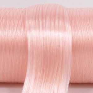 A pale, light pink high quality nylon doll hair for rerooting dolls, monster high reroots, standard 11.5 inch fashion dolls, custom rehairing and restoring all doll and toy types. A great match for RH Bella!