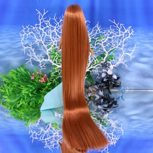 A warm auburn brown Japanese saran doll hair for rerooting standard 11.5 inch fashion dolls, monster high reroots, custom doll rehairing and restoring all doll and toy types. Ariel mermaid reroot not included.