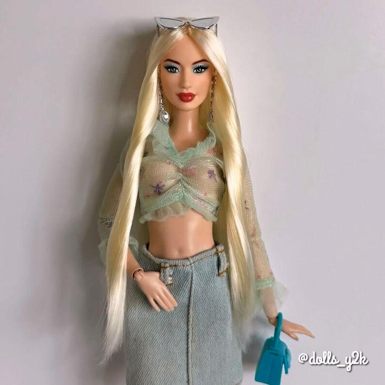 A pale blonde nylon doll hair for rerooting dolls, monster high reroots, standard 11.5 inch fashion dolls, custom rehairing and restoring all doll and toy types. Example Barbie reroot shown.  Doll rehair not included.