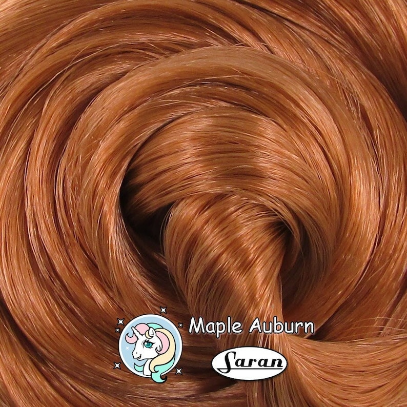 A warm auburn brown Japanese saran doll hair for rerooting standard 11.5 inch fashion dolls, monster high reroots, custom doll rehairing and restoring all doll and toy types.