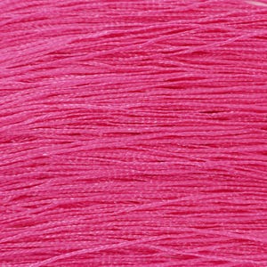 May include: A close-up of a bundle of bright pink embroidery floss.