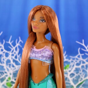 A warm auburn brown Japanese saran doll hair for rerooting standard 11.5 inch fashion dolls, monster high reroots, custom doll rehairing and restoring all doll and toy types. Ariel mermaid reroot not included.