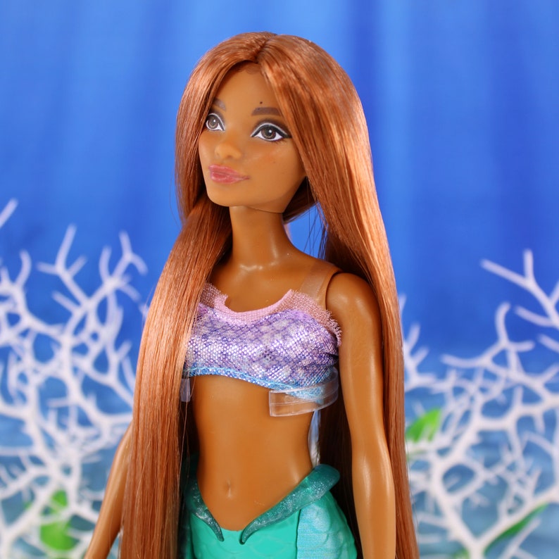 A warm auburn brown Japanese saran doll hair for rerooting standard 11.5 inch fashion dolls, monster high reroots, custom doll rehairing and restoring all doll and toy types. Ariel mermaid reroot not included.