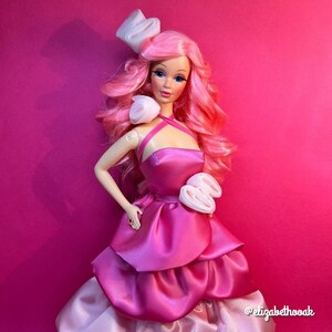 A bright pink high quality nylon doll hair for rerooting dolls, monster high reroots, standard 11.5 inch fashion dolls, custom rehairing and restoring all doll and toy types. PJ doll reroot not included.
