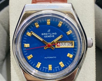 Orologio da polso da uomo vintage Breitling Geneve con data e giorno automatico, quadrante blu, movimento svizzero