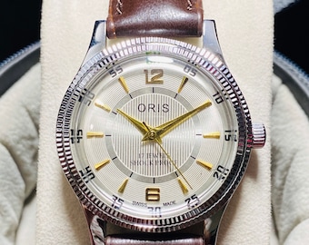 vintage Oris cadran blanc remontage manuel 17 rubis mouvement FHF ST-96 fabrication suisse montre homme