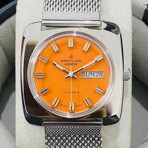 Vintage Breitling Geneve Automatisches Datum / Tag Oranges Zifferblatt Schweizer Uhrwerk Herrenarmbanduhr - Schweizer Armbanduhr