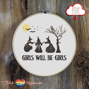 May include: A cross stitch pattern featuring three witches holding hands with the text "Girls will be girls" below them. The pattern also includes a moon, bats, and a tree.