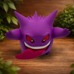 May include: A purple Gengar figurine with pointed ears and spikes on its back. The character has red eyes with black pupils, a wide white mouth, and a long, protruding dark pink tongue. The figure has a smooth, matte texture and rounded arms.