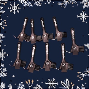 May include: Ten small black paint brushes with white lettering on the handles. The names on the brushes are Billy, Turk, Legend, Henri, Junior, Koda, Parker, Oliver, Mackenzie.